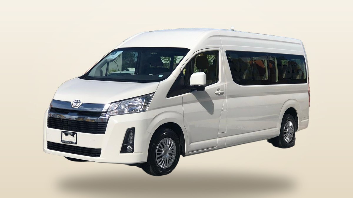 White Toyota Hiace passenger van from our own fleet